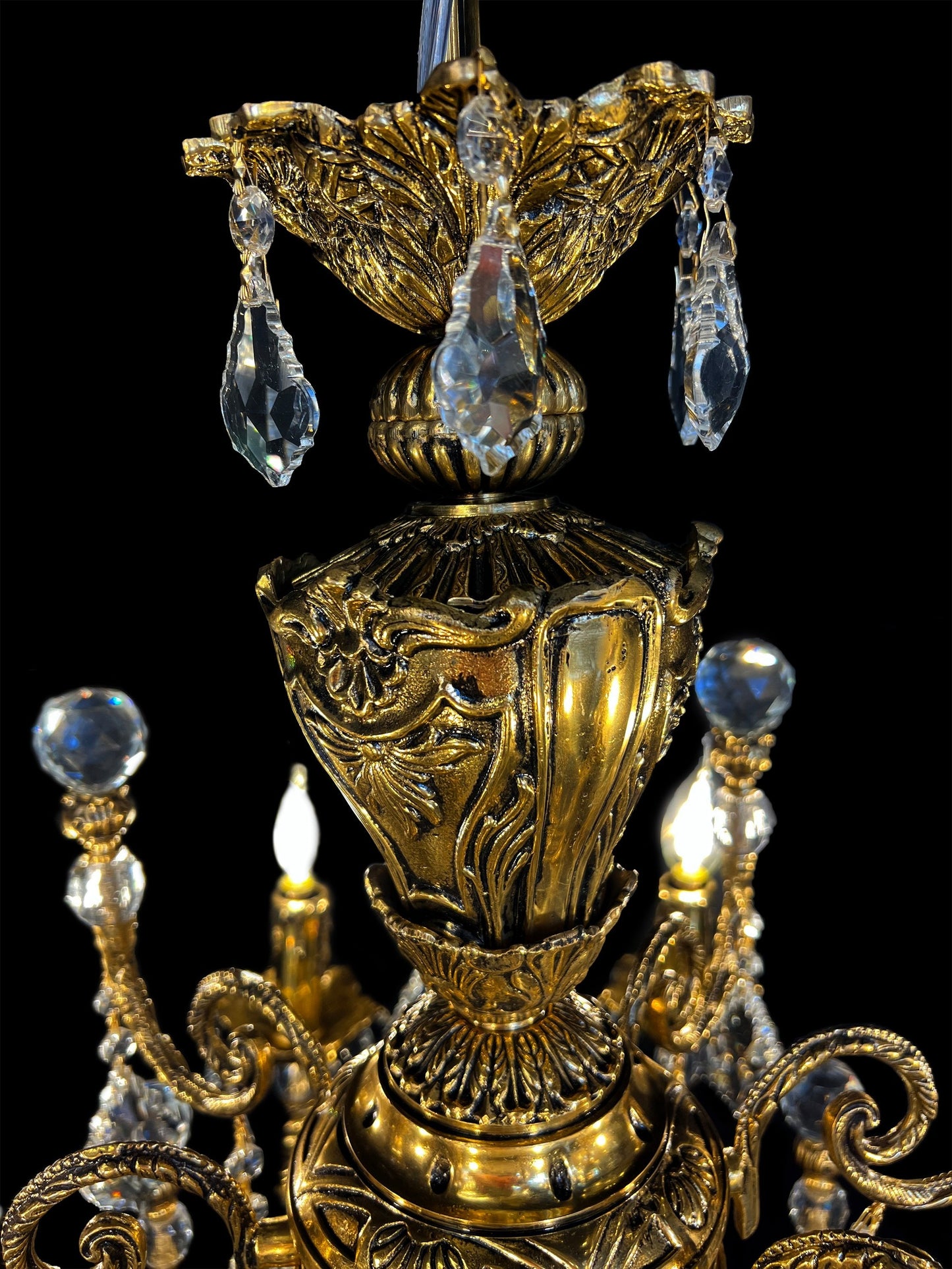 Close view of ornate bronze frame with precision-cut crystals