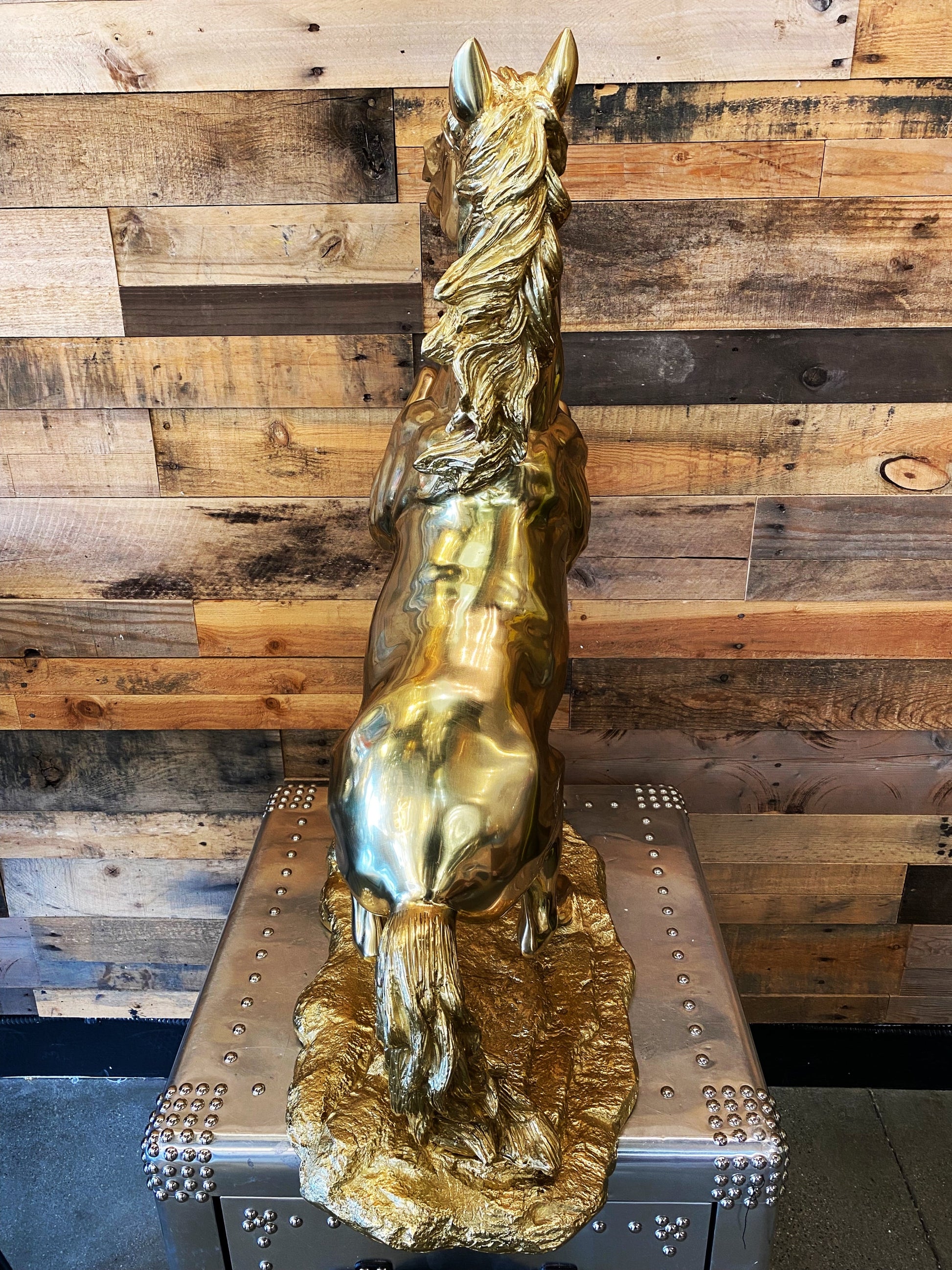 Rear view of the majestic brass rearing horse, emphasizing its grand size and the quality of the Italian brass finish.