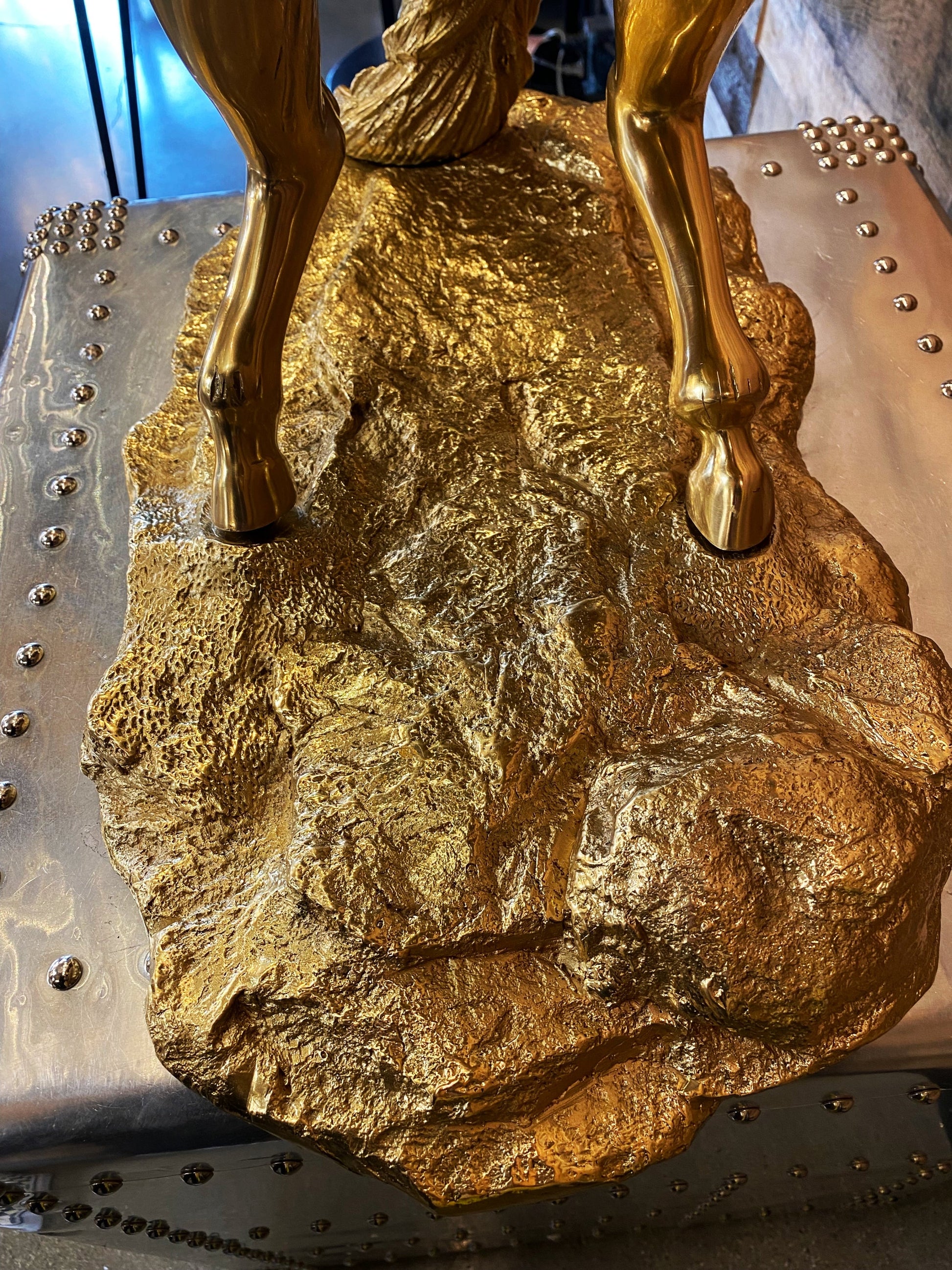 Close-up of the substantial and textured brass base that supports this 59 lb rearing horse masterpiece.