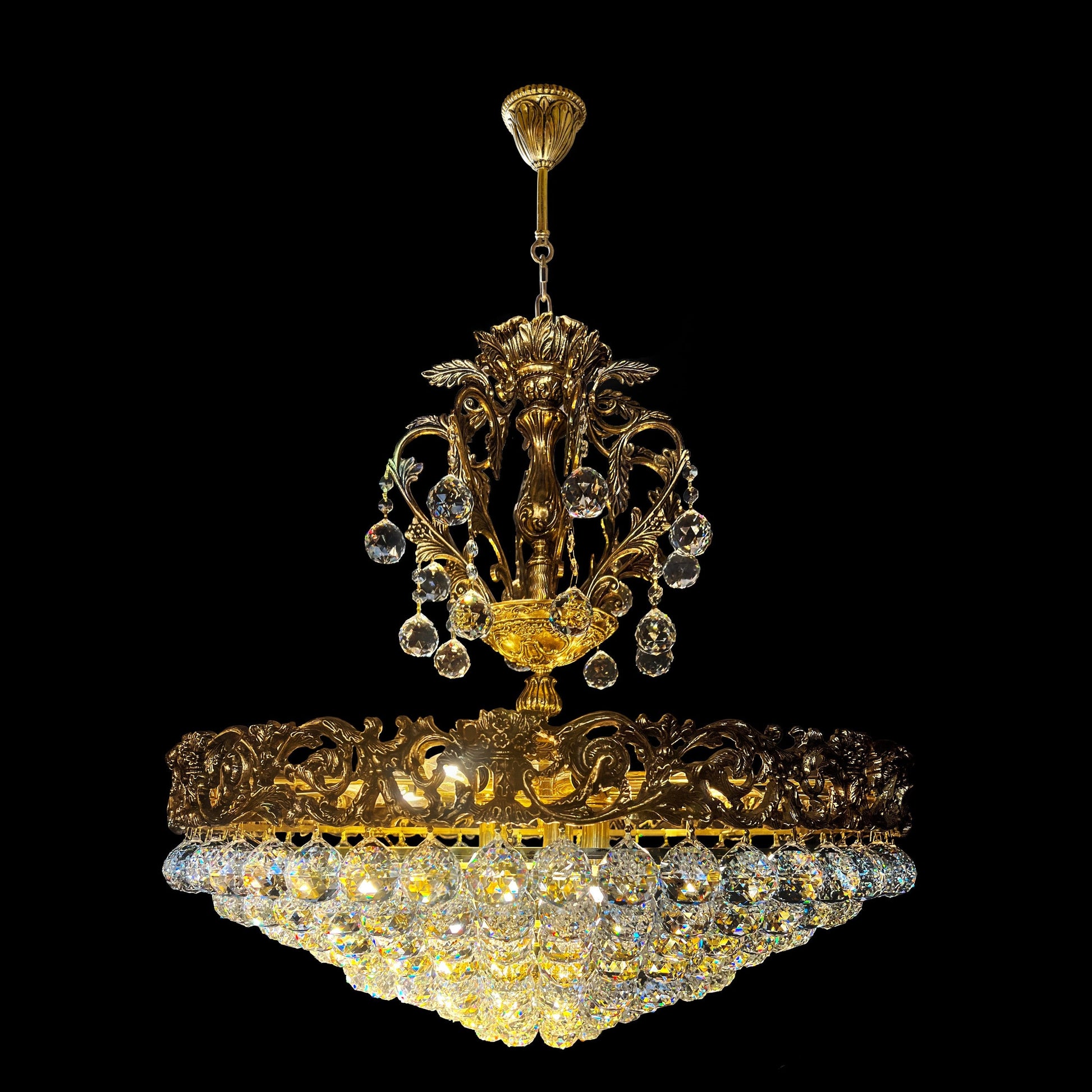 Handcrafted brass crystal chandelier with ornate detailing and brass  finish